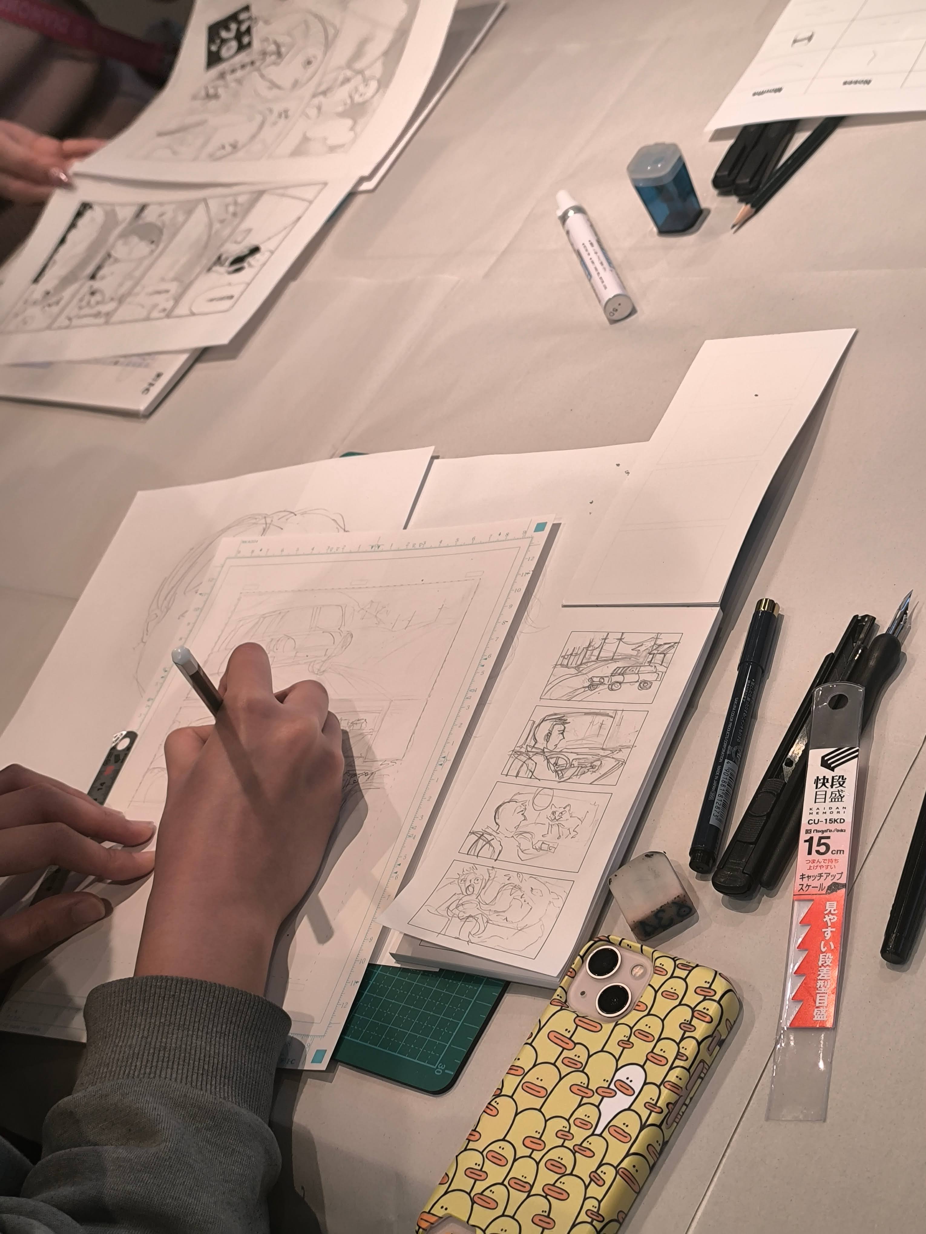 Sensei guiding a guest through the inking process